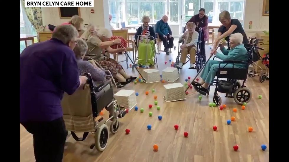 Elderly residents of care home play real-life Hungry Hippos during coronavirius isolation.mp4
