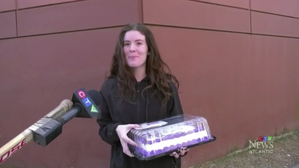 Canadian reporters use mic on end of hockey stick