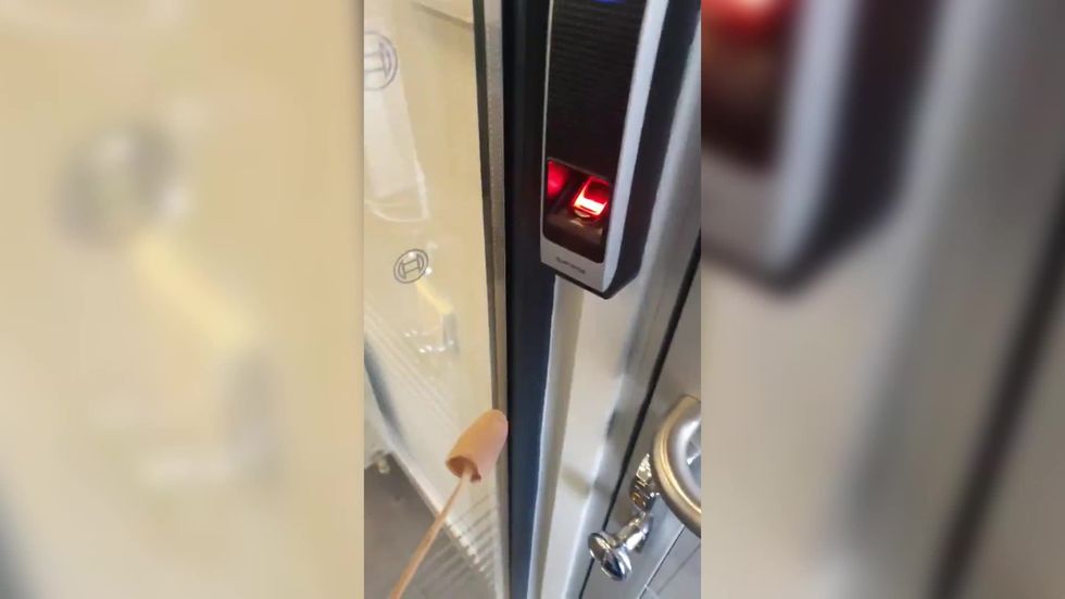 Man invents 'finger on a stick' to avoid germs