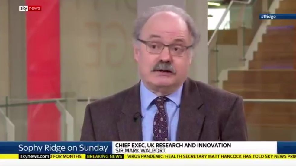 Government's research chief says coronavirus vaccine may take up to a year
