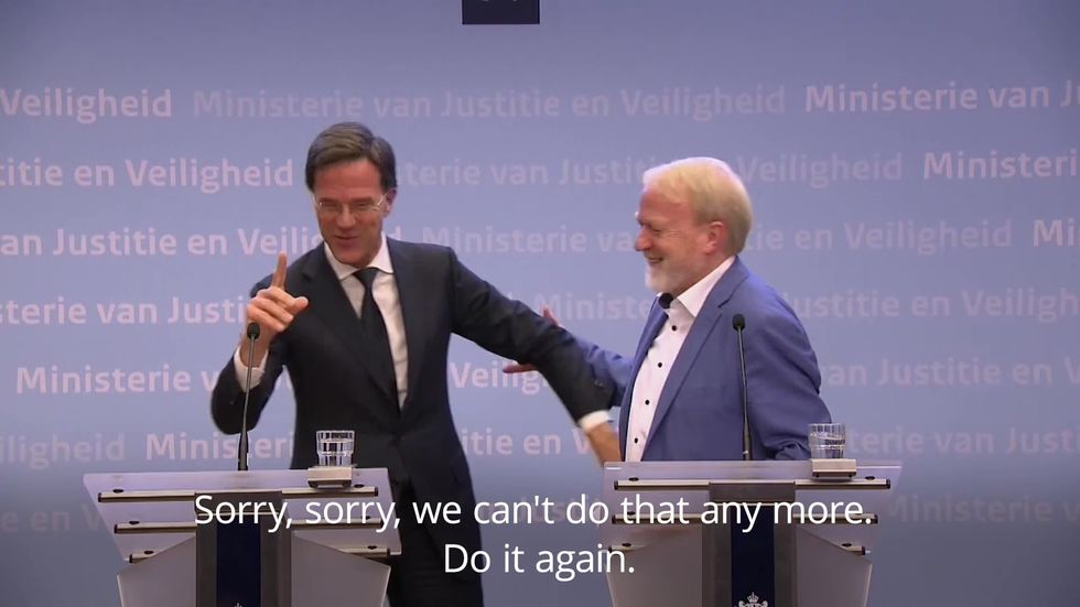 Dutch PM ends press conference by shaking hands with colleague moments after warning public against doing so