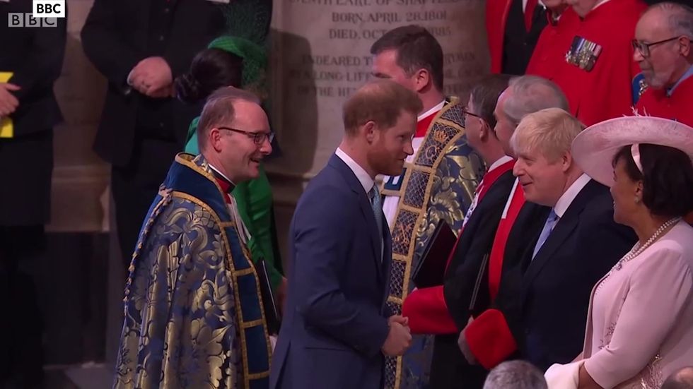 Prince Harry and Boris Johnson greet each other at Westminster Abbey