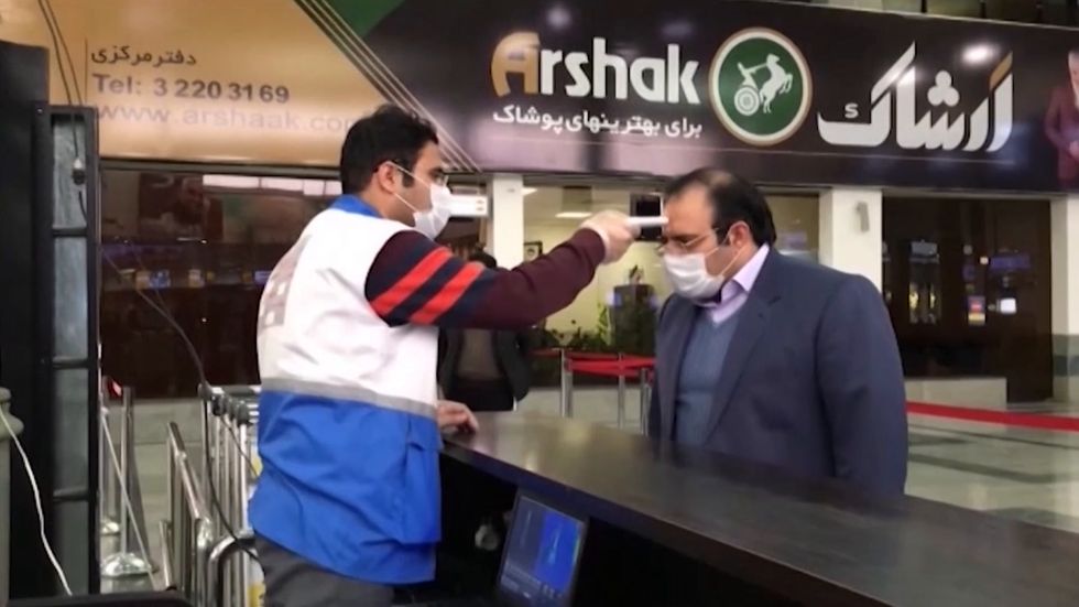 Coronavirus: Temperature checks and disinfection at Iran airport