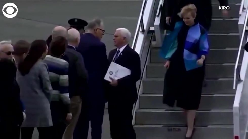 Mike Pence greets governor with 'coronavirus handshake' amid backlash over lack of testing kits in US