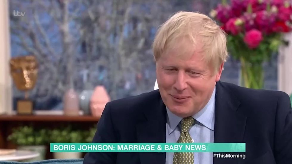 Boris shuffles awkwardly in seat when Holly and Philip ask him about changing nappies
