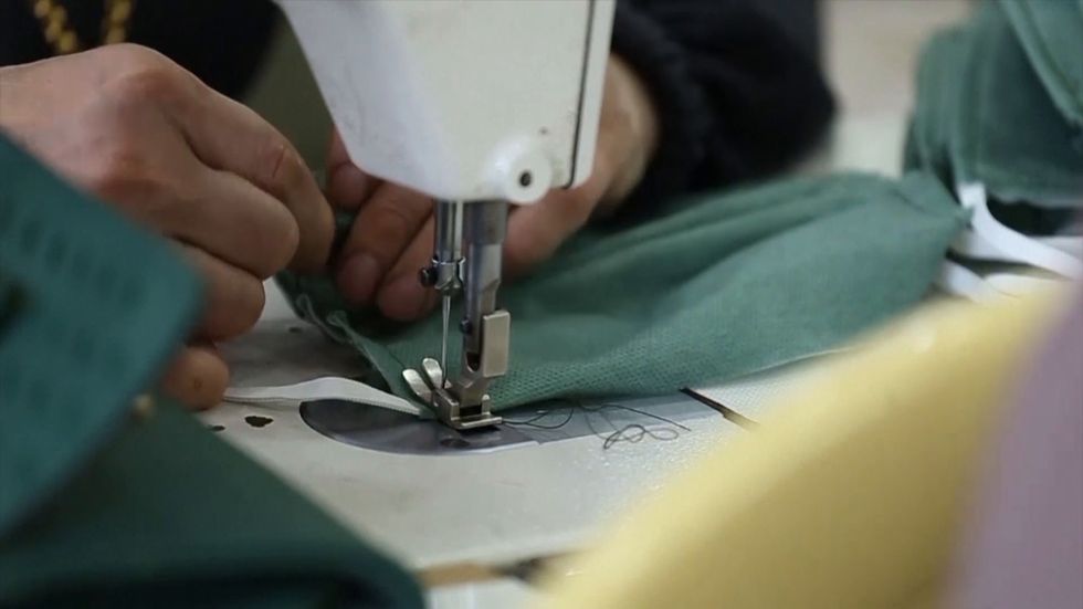 Masks are made in Iraq to combat coronavirus