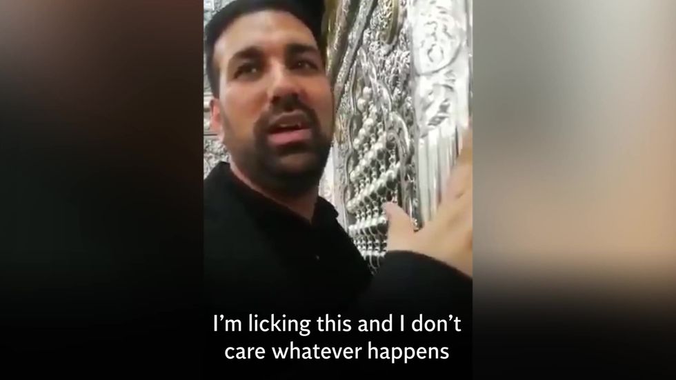 Men who licked holy shrines in Iran face jail for ignoring coronavirus health warnings