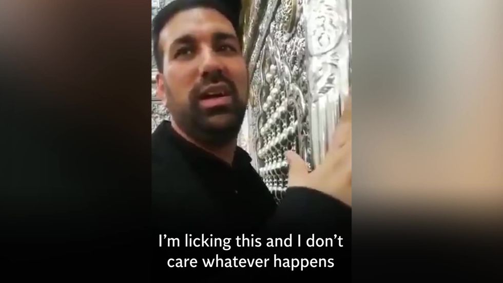 Men who licked holy shrines in Iran face jail for ignoring coronavirus health warnings