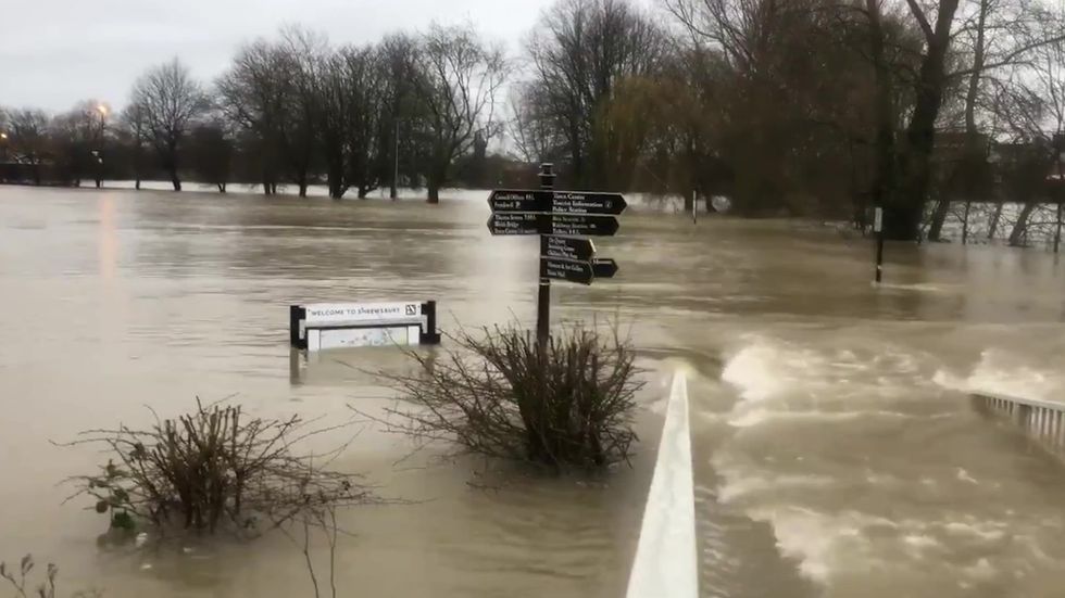 Floodwater cascades down streets in Shrewsbury