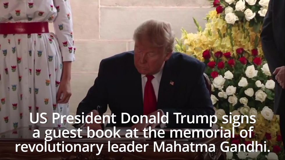Donald Trump signs guest book at Gandhi memorial