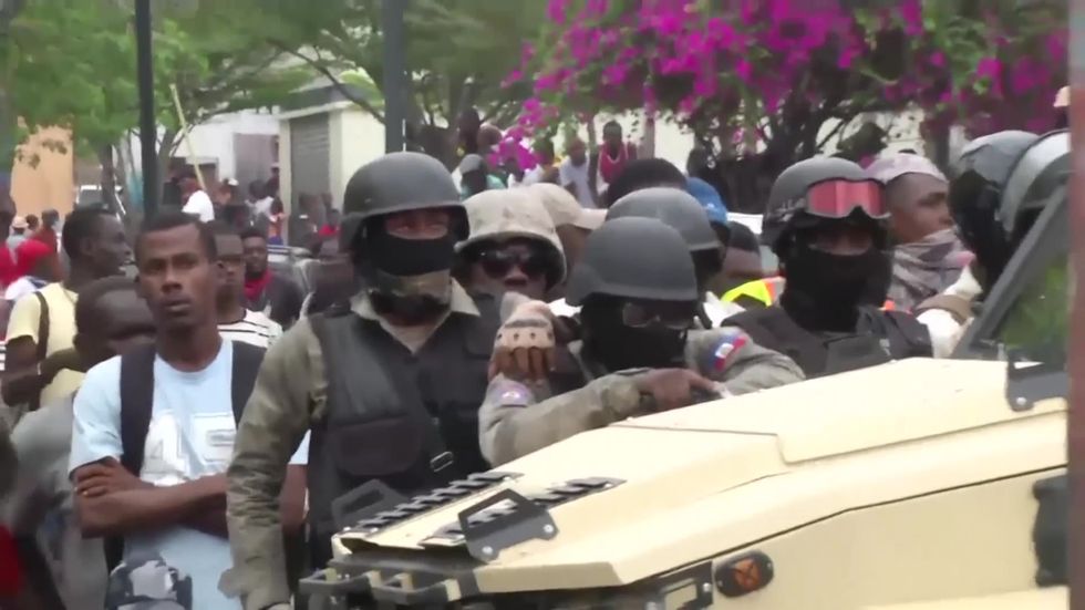 Haiti police exchange fire with troops during protests