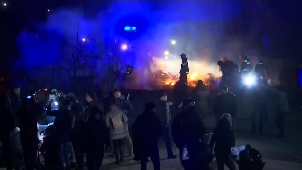 Ukrainian protesters attack buses carrying China evacuees as panic over outbreak spreads