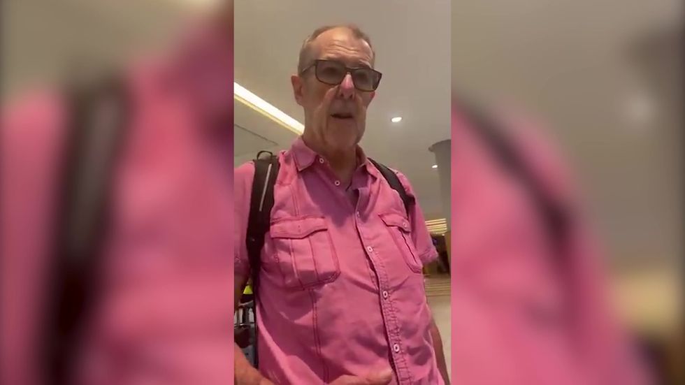 Laura Whitmore uploads footage of member of paparazzi following her through airport