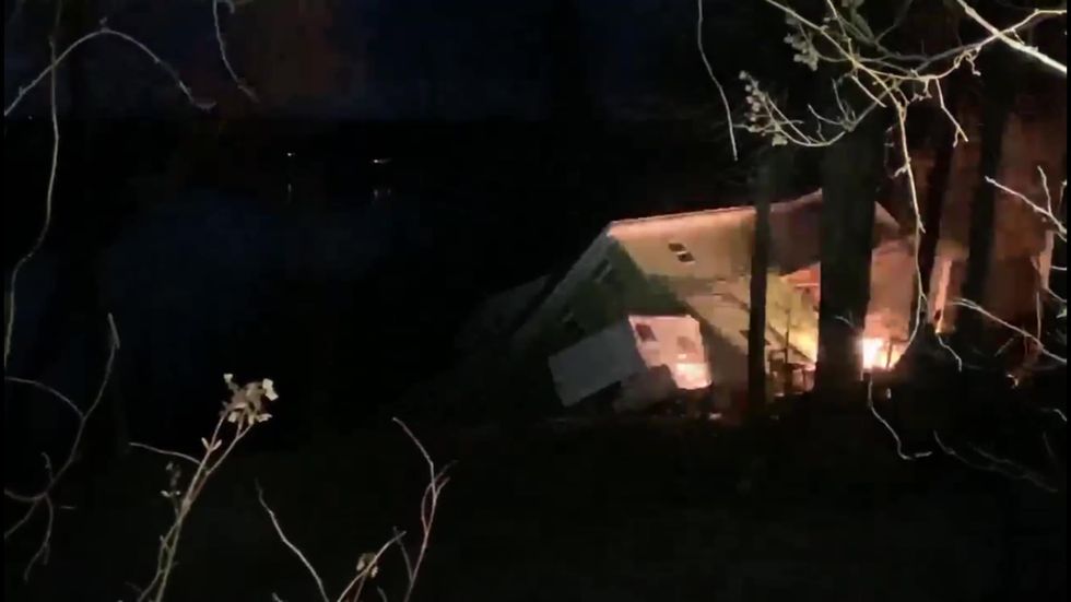 Homes collapse into river in Tennesse landslide