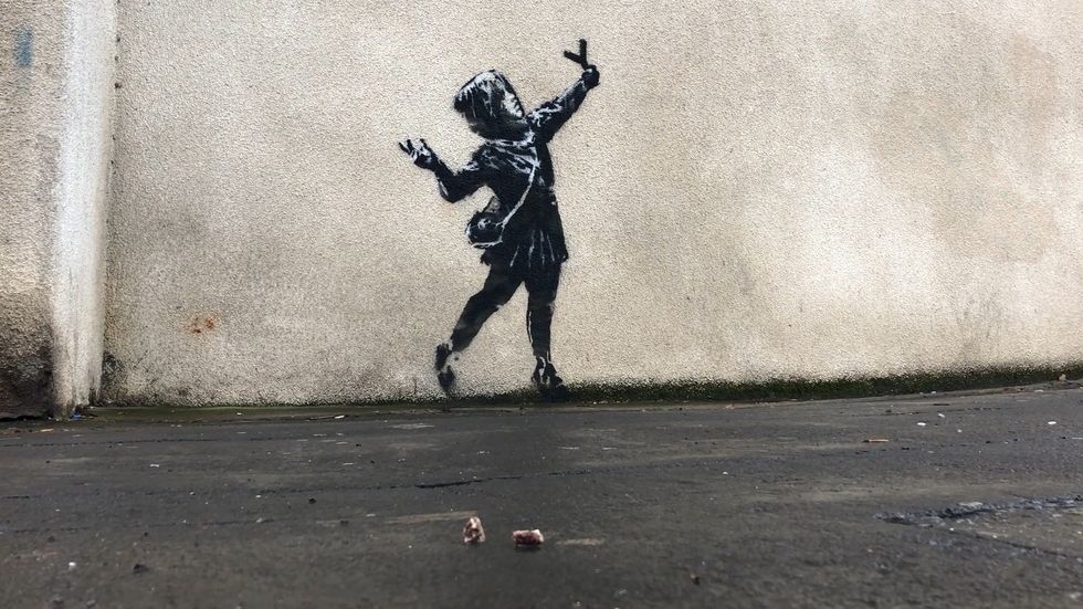 Valentine's Day-inspired street art 'created by Banksy' appears in his home city of Bristol