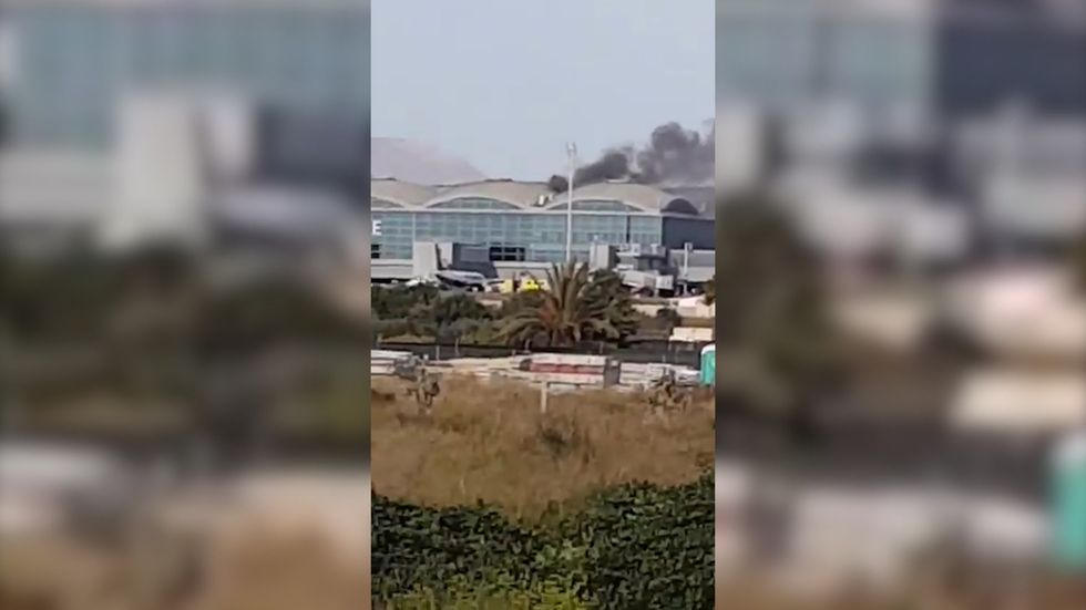 Smoke seen coming from Alicante airport as fire breaks out on roof of terminal