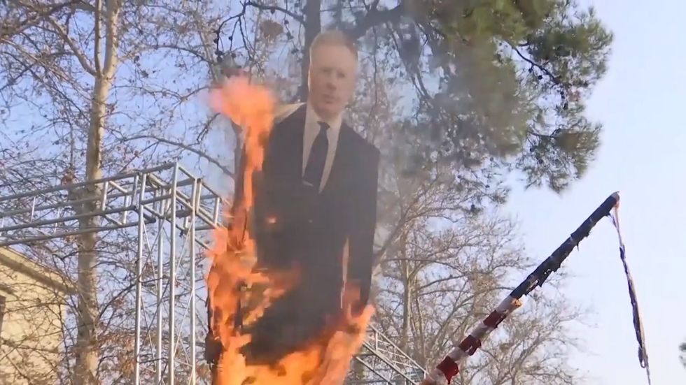Effigy of UK ambassador to Iran set on fire in Tehran
