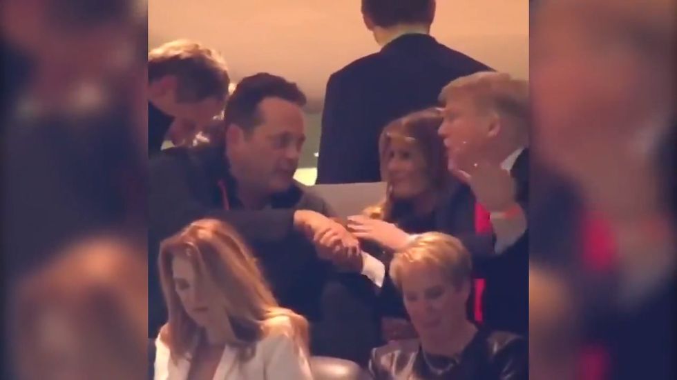 Vince Vaughn shakes hands with Trump at football game