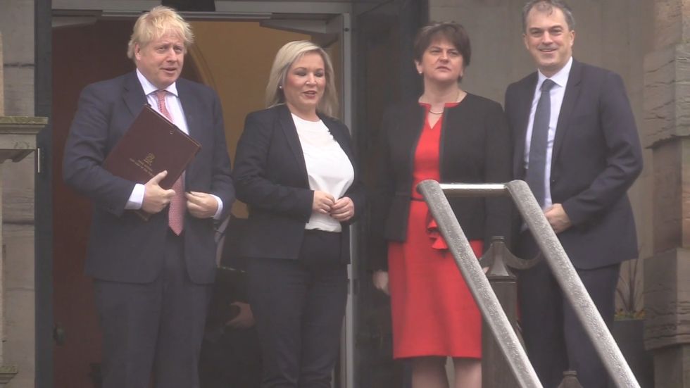 Boris Johnson is greeted by Arlene Foster at Stormont