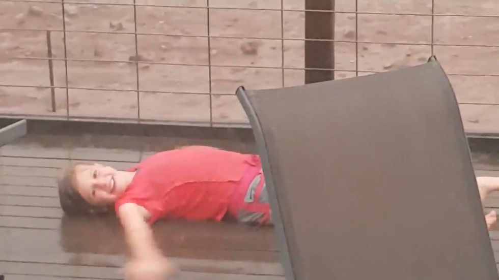 Australia wildfires: 10-year-old girl celebrates as rain falls in New South Wales