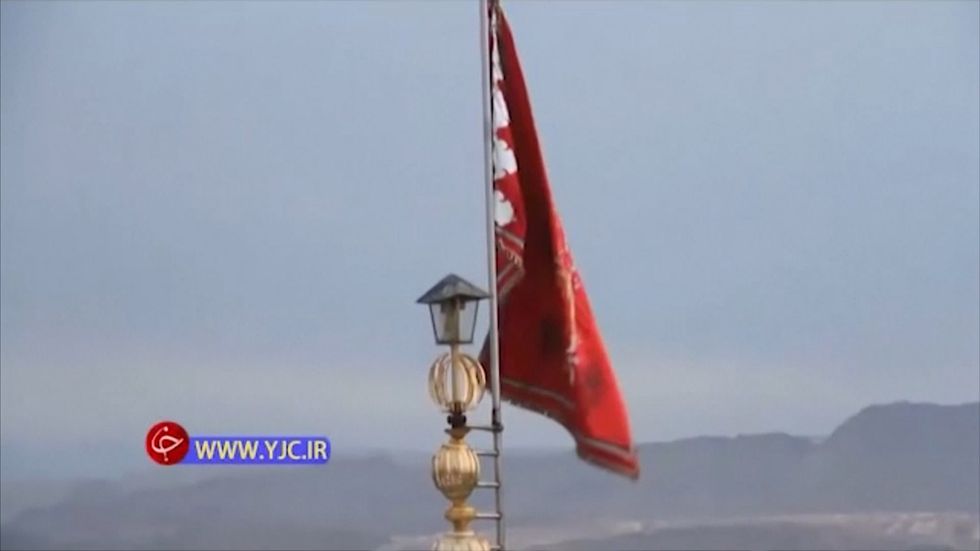 Red flag signaling war raised atop the Jamkaran mosque in Iran