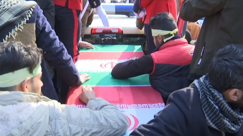General Qassem Soleimani's casket passes in Iraq funeral procession