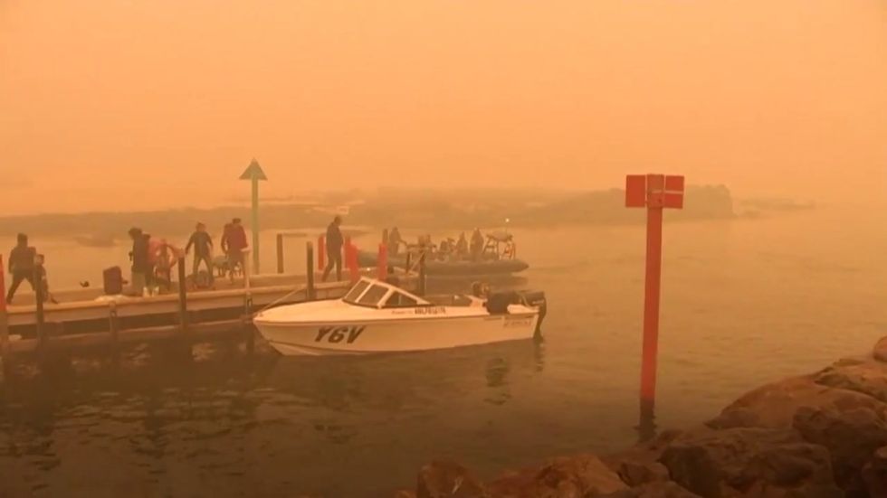 Australian navy begins evacuating wildfire survivors