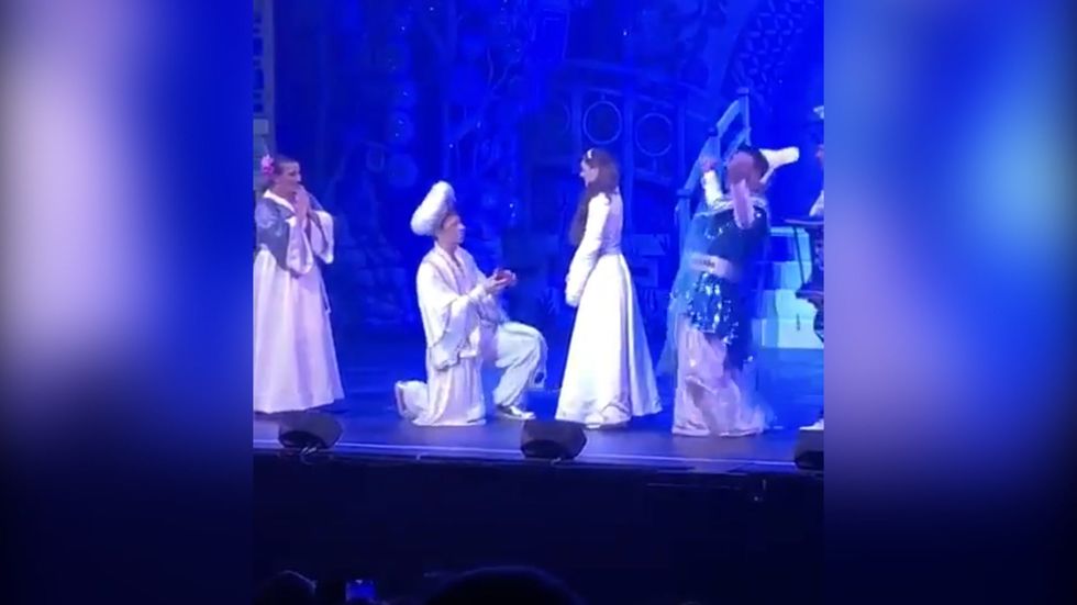 Aladdin proposes to Jasmine at end of pantomime performance