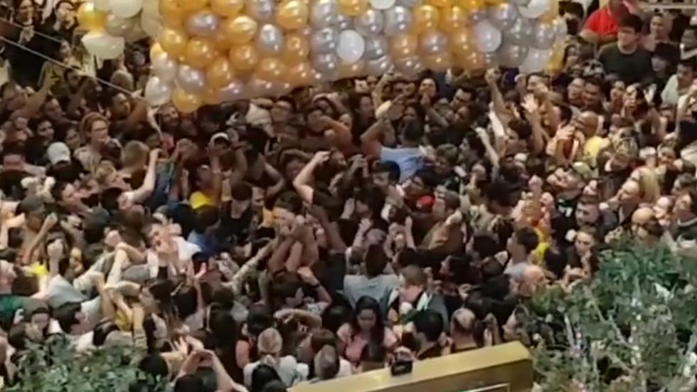 Several people injured in crowd crush after Christmas giveaway balloon drop in Sydney