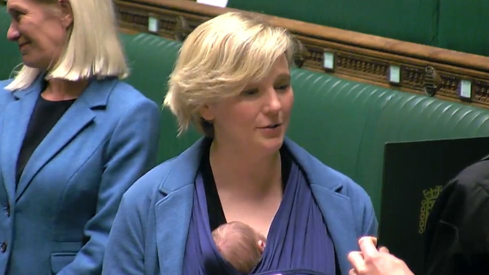 Walthamstow MP Stella Creasy holds baby as she is sworn in