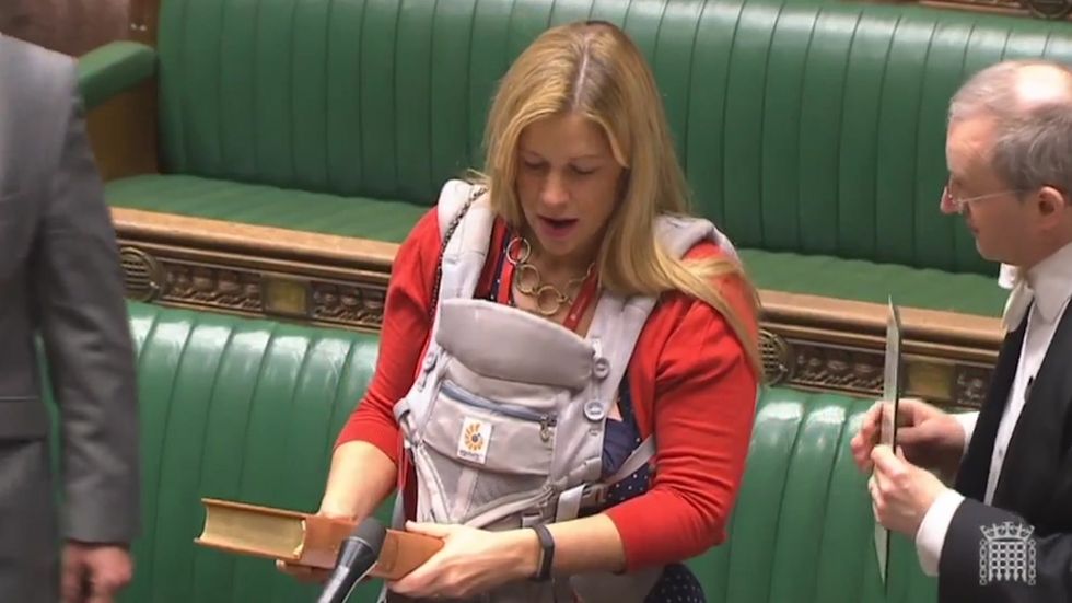 Labour MP Ellie Reeves carries her little baby with her as newly-elected MPs are officially sworn in