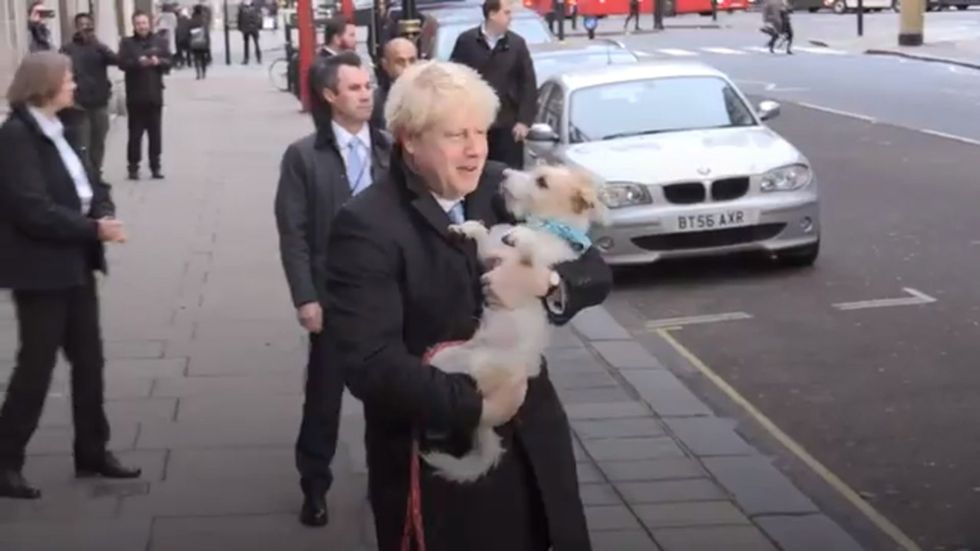 Boris Johnson arrives with his dog Dilyn to cast General Election vote