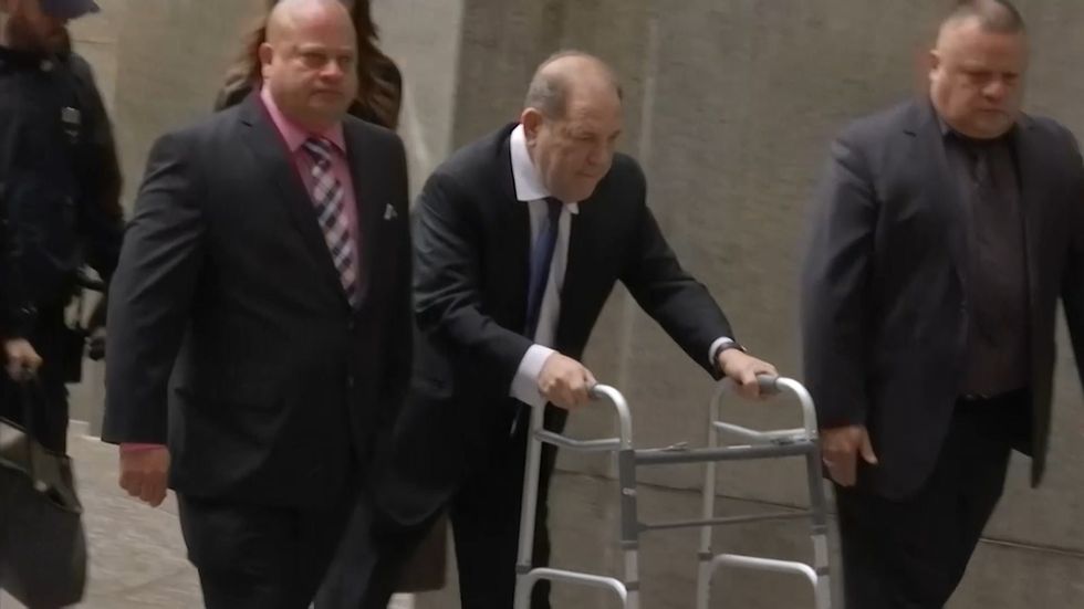 Harvey Weinstein arrives at court using a walking frame