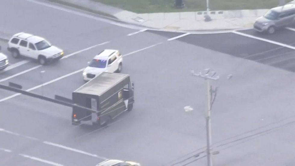 Four people killed after robbers stole UPS truck leading police on chase ending in gunfire in  Florida 