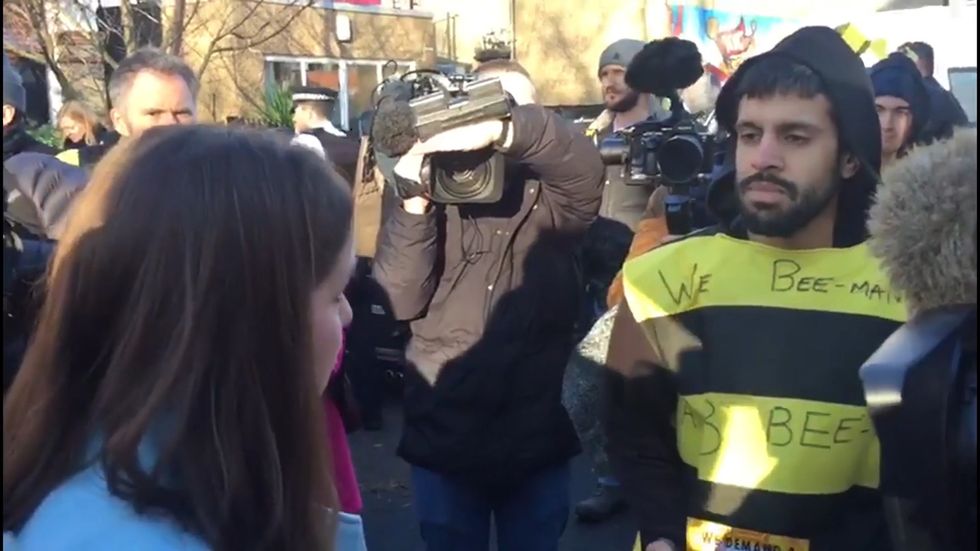 Climate change protesters glue themselves to Lib Dem electric bus