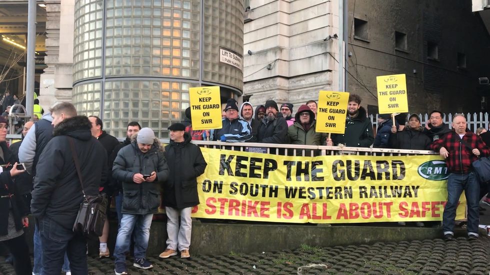 Rail workers on strike at Waterloo station