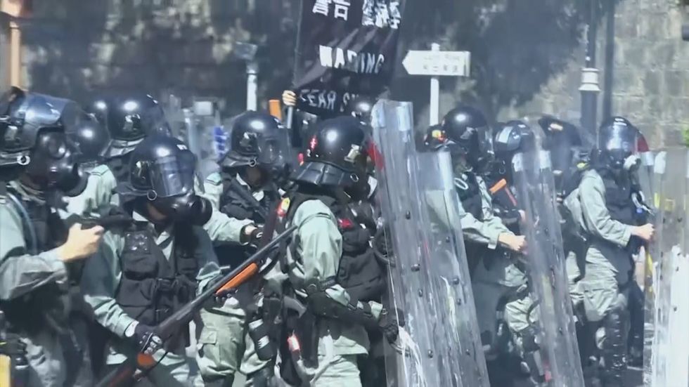Police teargas protesters at Hong Kong Polytechnic University