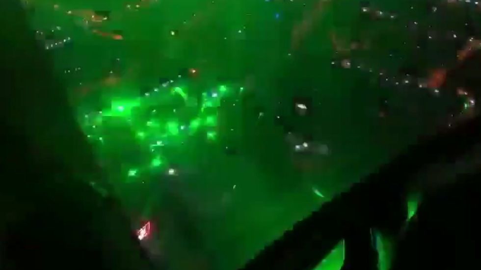 Chile protesters fighting riot police with lasers