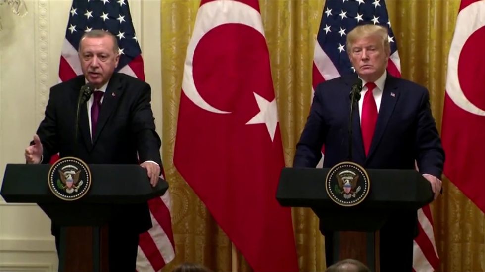 Erdogan says he handed back 'tough guy' letter to Trump as two leaders at odds over Kurds