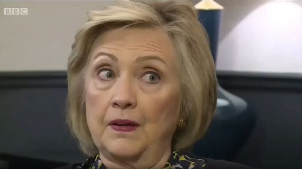 Hillary Clinton says the UK government should release Russia report