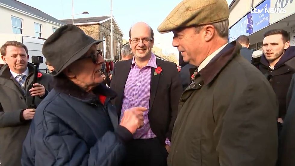 Nigel Farage called out for being a political coward by elderly resident during Wales visit