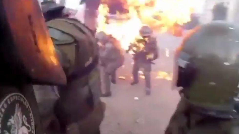 Police officer set on fire in Chile protests