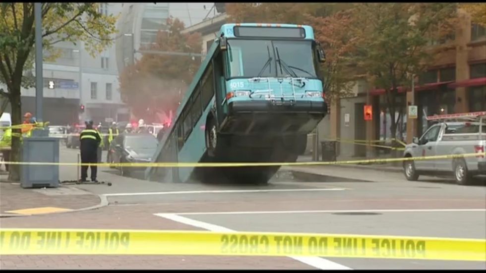 Sinkhole swallows bus on busy street in Pittsburgh