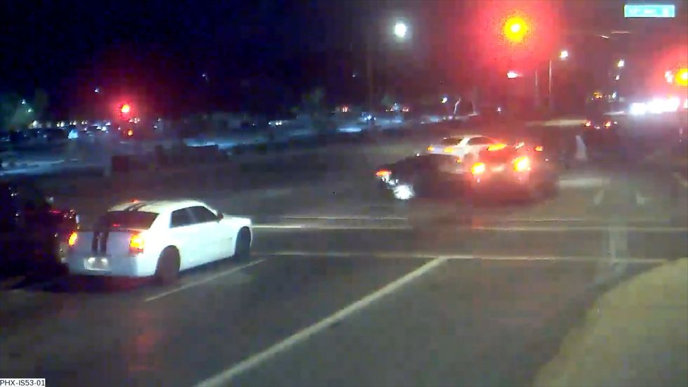 Couple with pushchair saved after car knocks other vehicle out of their path