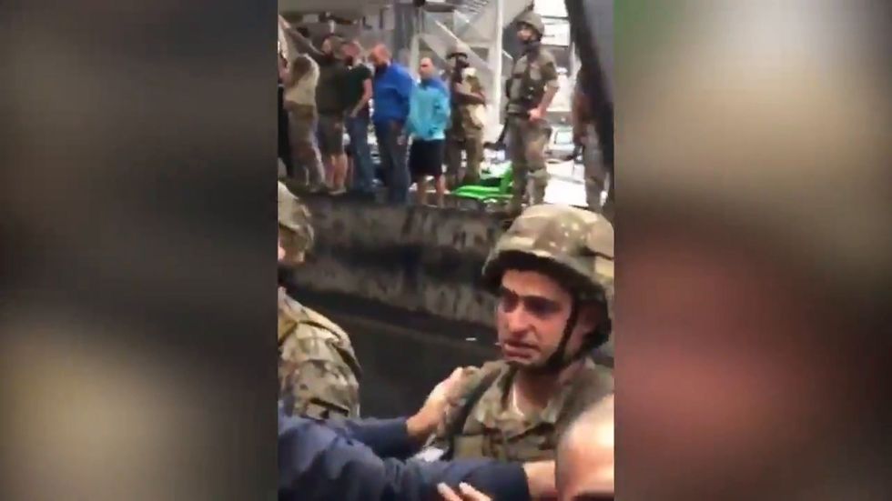 Lebanon protests: Soldier breaks down into tears during standoff between demonstrators and army
