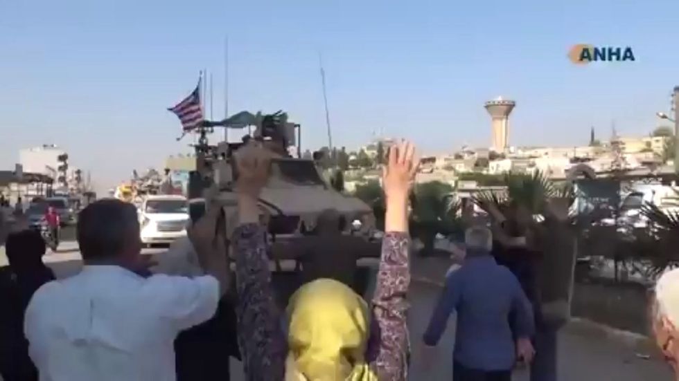 US troops in Syria pelted with fruit as they withdraw