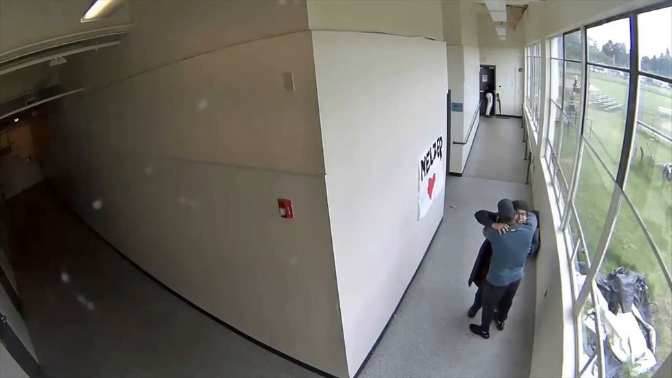 CCTV shows moments after high school coach disarms student with shotgun in Oregon