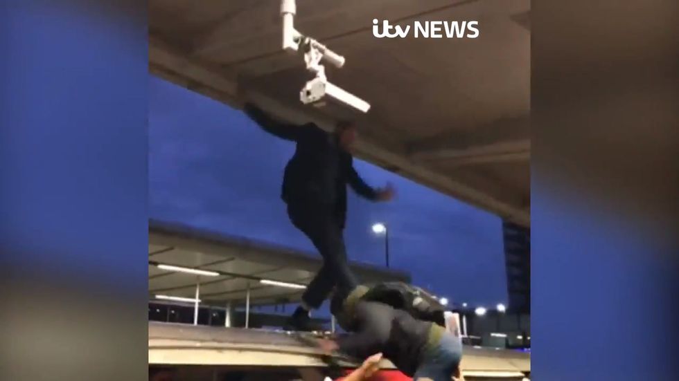 Extinction Rebellion protester dragged off tube train after disruption at Canning Town in London