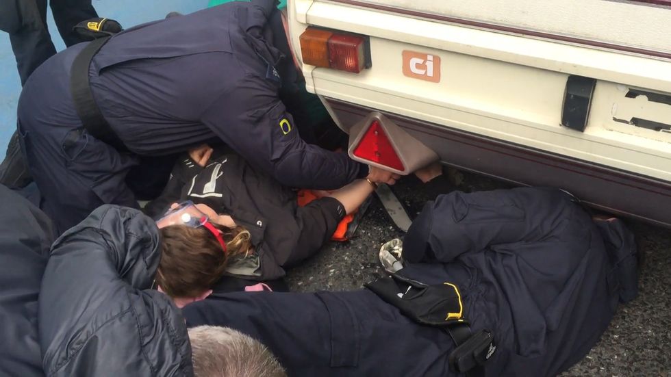 Extinction Rebellion protesters lock themselves to caravan at Millbank Tower