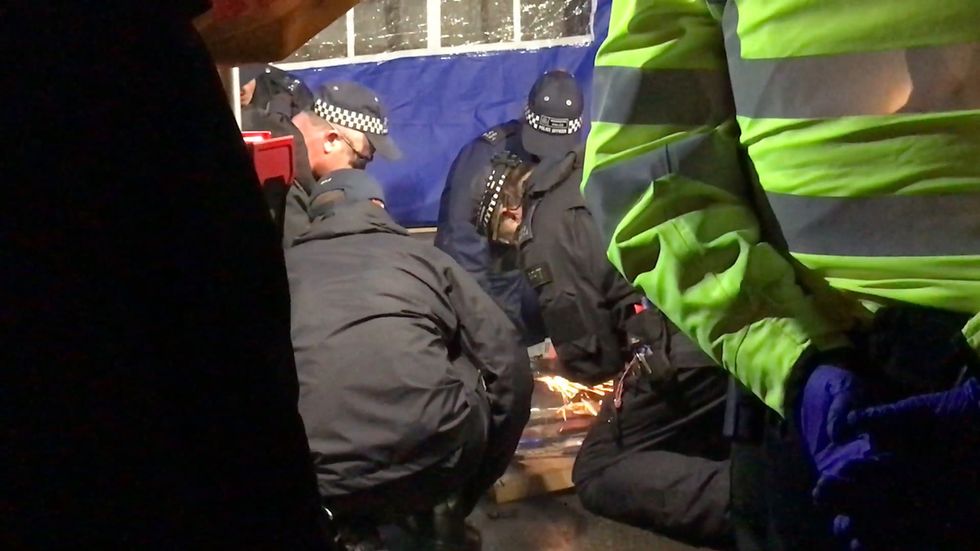 Police cut activists out of locks as they begin to clear Extinction Rebellion protesters out of locations in central London